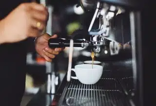 Person Using Espresso Machine