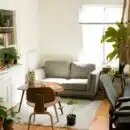 gray fabric loveseat near brown wooden table