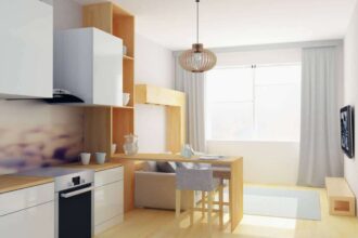 studio aménagé avec un fauteuil lit convertible et des accessoires modernes